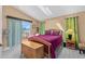 Bedroom featuring a queen-sized bed, skylight, private balcony and neutral decor at 856 Wisconsin Ave, Palm Harbor, FL 34683