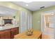 Open kitchen layout, connecting to a cozy Gathering room with fireplace at 856 Wisconsin Ave, Palm Harbor, FL 34683