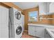 Convenient laundry room with stacked washer/dryer and ample counter space at 856 Wisconsin Ave, Palm Harbor, FL 34683