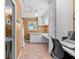 Laundry room with washer, dryer, built-in cabinets, and counter space at 856 Wisconsin Ave, Palm Harbor, FL 34683