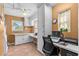 Office space complete with countertop workspace and plenty of natural light at 856 Wisconsin Ave, Palm Harbor, FL 34683