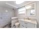Stylish renovated bathroom featuring new shower stall, vanity with marble countertop and single sink at 8705 Village Mill Row, Hudson, FL 34667