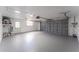 Clean and spacious garage with ample room for parking and storage, freshly painted floor at 8705 Village Mill Row, Hudson, FL 34667