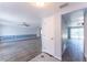 Bright, open-concept living room with tile floors and a view of other rooms at 8705 Village Mill Row, Hudson, FL 34667