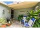 Inviting entrance area with comfortable seating, potted plants, and stylish decor, offering a warm welcome at 9040 Mark Twain Ln, Port Richey, FL 34668