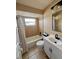 Bathroom with tub-shower combo, vanity, and tile floor at 9350 Barrington Ln, Port Richey, FL 34668