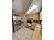 Well-equipped kitchen featuring stainless steel appliances, light wood cabinets, and ample counter space for meal preparation at 9350 Barrington Ln, Port Richey, FL 34668