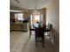 Kitchen with wood cabinets, tile floor, and breakfast nook at 9350 Barrington Ln, Port Richey, FL 34668