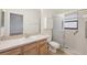 This bathroom features a shower, with a single sink vanity, and tile flooring at 1005 Indigo Run Ct, Spring Hill, FL 34609