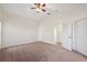 The bedroom has a ceiling fan and a window with natural light at 1005 Indigo Run Ct, Spring Hill, FL 34609