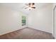This bright bedroom has a ceiling fan, a window with natural light, and a closet at 1005 Indigo Run Ct, Spring Hill, FL 34609