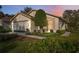 Charming single-story home featuring a well-manicured lawn, tidy landscaping, and an attached two-car garage at 1005 Indigo Run Ct, Spring Hill, FL 34609