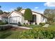 Charming single-story home with well-maintained lawn and a spacious two-car garage at 1005 Indigo Run Ct, Spring Hill, FL 34609
