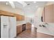 Open kitchen with stainless steel appliances and light wood cabinets at 1005 Indigo Run Ct, Spring Hill, FL 34609