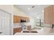 Bright kitchen featuring white countertops, modern appliances, and ample cabinet space at 1005 Indigo Run Ct, Spring Hill, FL 34609