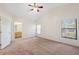 This main bedroom is spacious and bright with a window for natural light at 1005 Indigo Run Ct, Spring Hill, FL 34609