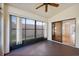 The sunroom has windows overlooking the back and a sliding glass door to the inside at 1005 Indigo Run Ct, Spring Hill, FL 34609