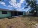 Large backyard with a screened in patio, perfect for relaxing and entertaining at 10921 Stamford Dr, Port Richey, FL 34668