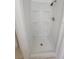 All white shower with built in shelves at 10921 Stamford Dr, Port Richey, FL 34668