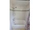 Bathroom featuring tile and a shower and tub combo at 10921 Stamford Dr, Port Richey, FL 34668