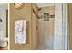 Modern bathroom features an elegant tiled shower with glass accents and bronze hardware at 11256 Holbrook St, Spring Hill, FL 34609