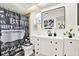 Stylish bathroom with modern vanity, sleek mirror, and decorative shower curtain at 11256 Holbrook St, Spring Hill, FL 34609