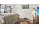 Comfortable bedroom featuring wood floors, neutral paint, and decorative curtains at 11256 Holbrook St, Spring Hill, FL 34609
