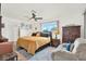 Spacious bedroom showcasing a king bed, sitting area, and ample natural light at 11256 Holbrook St, Spring Hill, FL 34609