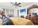 Comfortable bedroom featuring a king bed, TV, and classic wooden furniture at 11256 Holbrook St, Spring Hill, FL 34609