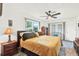 Bright bedroom highlighting a king bed, window view, and classic wooden furniture at 11256 Holbrook St, Spring Hill, FL 34609