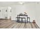 Eating area featuring seating for four, wood floors and a view of the backyard at 11256 Holbrook St, Spring Hill, FL 34609