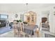 Elegant dining room boasts a decorative china cabinet and a view into the adjacent living room at 11256 Holbrook St, Spring Hill, FL 34609