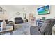 Bright and inviting living room with a comfortable sofa and tile flooring, great for relaxing at 11256 Holbrook St, Spring Hill, FL 34609