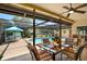 Inviting screened patio with outdoor seating, overlooking the beautiful pool and backyard at 11256 Holbrook St, Spring Hill, FL 34609