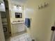 The bathroom features a modern vanity, updated lighting, and walk-in shower at 11310 Carriage Hill Dr # 4, Port Richey, FL 34668