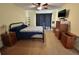 Bedroom with a cozy bed, wooden furniture, and black out curtains at 11310 Carriage Hill Dr # 4, Port Richey, FL 34668
