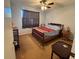 Bedroom featuring a ceiling fan, comfortable bed, and soft natural light at 11310 Carriage Hill Dr # 4, Port Richey, FL 34668