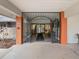 Elegant entry to Timber Oaks Clubhouse via decorative wrought iron gates and tiled floor at 11310 Carriage Hill Dr # 4, Port Richey, FL 34668