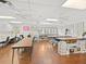 Spacious sewing room with tables, crafting supplies, and plenty of natural light at 11310 Carriage Hill Dr # 4, Port Richey, FL 34668