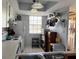 Kitchen features white appliances and cabinets with lots of natural light at 11310 Carriage Hill Dr # 4, Port Richey, FL 34668