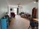 Cozy living room with comfortable seating, ceiling fan, and sliding door access at 11310 Carriage Hill Dr # 4, Port Richey, FL 34668