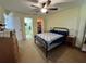 Bedroom with fan, furniture, walk in closet, and en suite bathroom at 11310 Carriage Hill Dr # 4, Port Richey, FL 34668