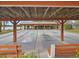 Shuffleboard courts featuring a covered seating area, providing a relaxing and recreational outdoor experience at 11310 Carriage Hill Dr # 4, Port Richey, FL 34668