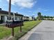 Street view showcasing mailboxes and manicured lawns of residential units at 11310 Carriage Hill Dr # 4, Port Richey, FL 34668