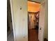 An open walk-in closet features clothing racks and a top shelf for storage at 11310 Carriage Hill Dr # 4, Port Richey, FL 34668