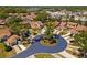 Aerial view of a charming neighborhood with well-manicured lawns, mature trees, and lovely single-Gathering homes at 11735 Rolling Pine Ln, Port Richey, FL 34668