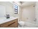 Bright bathroom featuring a shower-tub combination at 11735 Rolling Pine Ln, Port Richey, FL 34668