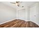 Bedroom with wood floors, ceiling fan and closet at 11735 Rolling Pine Ln, Port Richey, FL 34668