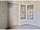 View of front door and sidelight windows at 11735 Rolling Pine Ln, Port Richey, FL 34668
