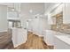 Bright kitchen with quartz counters, stainless steel appliances, and a tile backsplash at 11735 Rolling Pine Ln, Port Richey, FL 34668